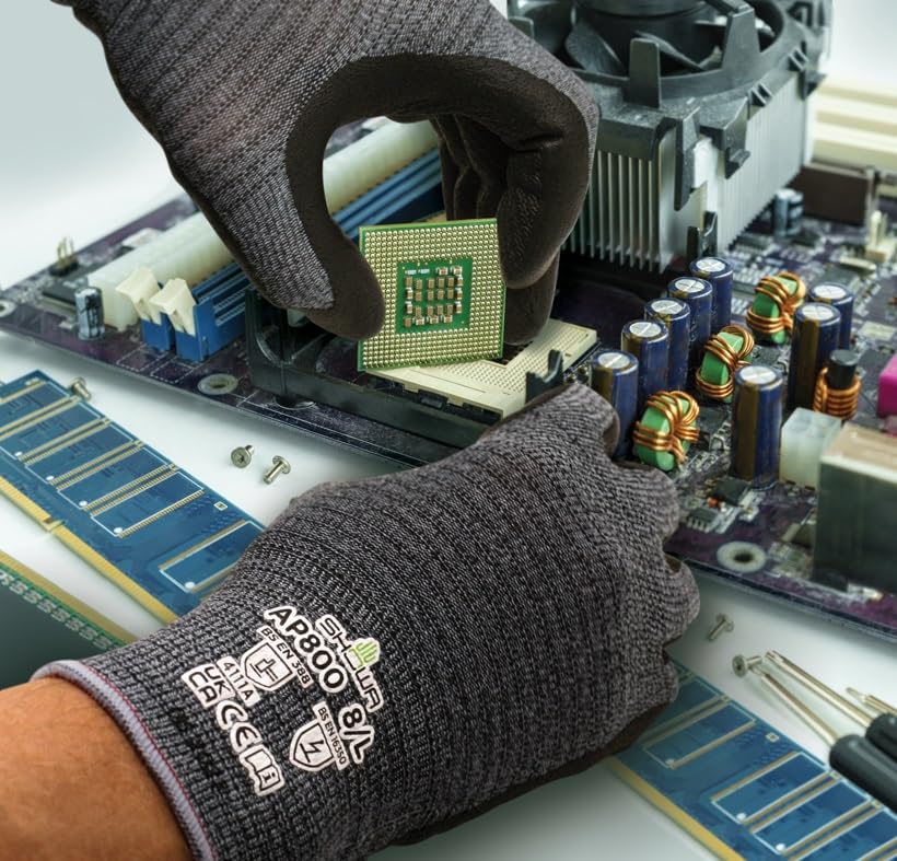 Worker wearing Showa® AP800 Static Dissipative Microfiber Nitrile Coated A4 Gloves while assembling a computer chip